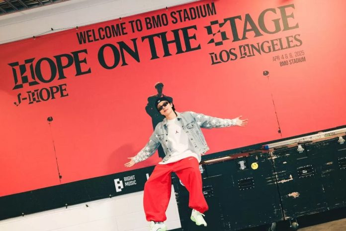 j hope di depan poster raksasa di bmo stadium